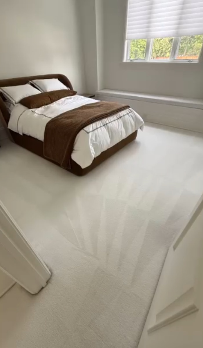 Clean cream bedroom carpet with fresh grooming strokes in a bright Vancouver home