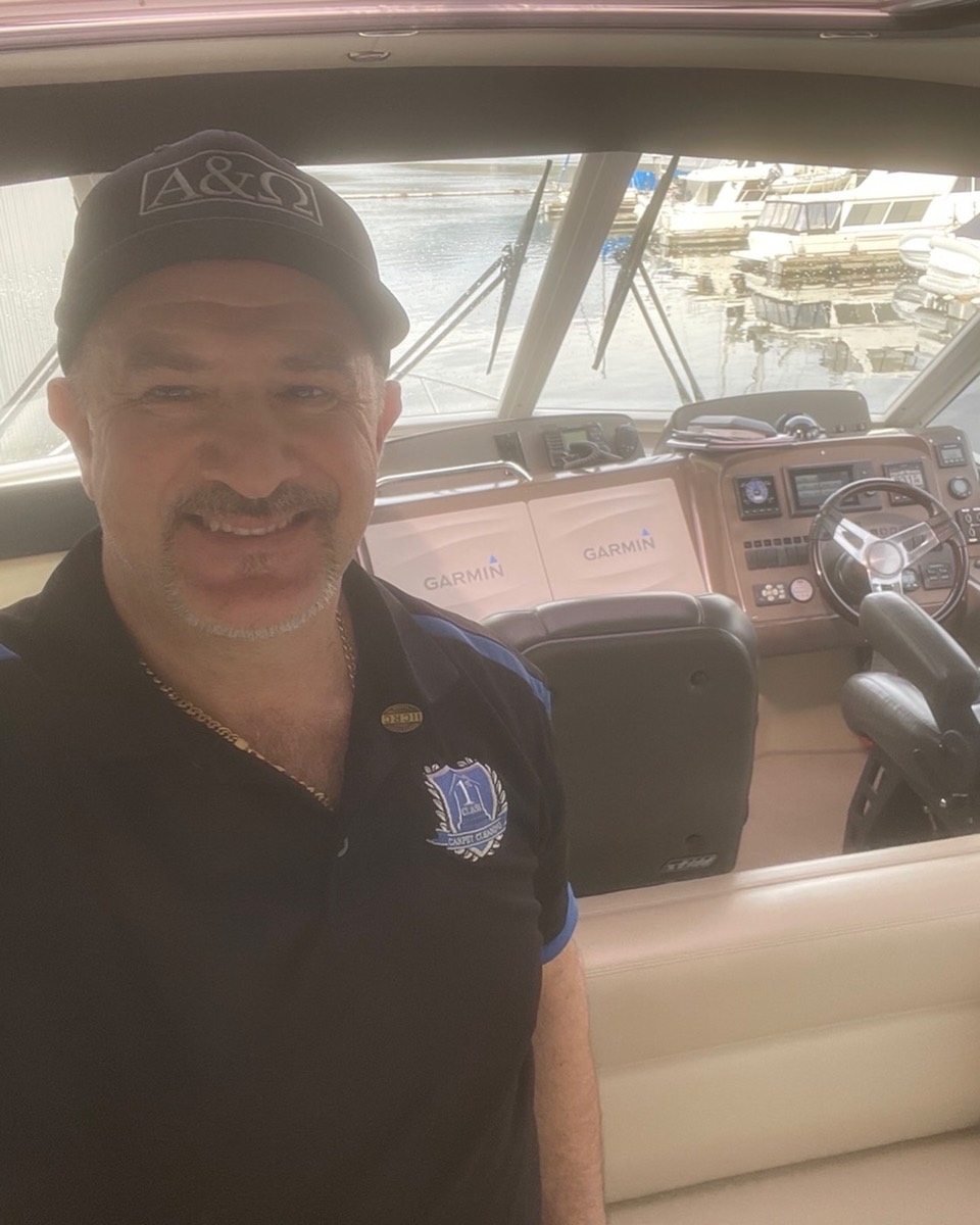 First Class Carpet Cleaning technician at a yacht helm during a marine cleaning job in Vancouver