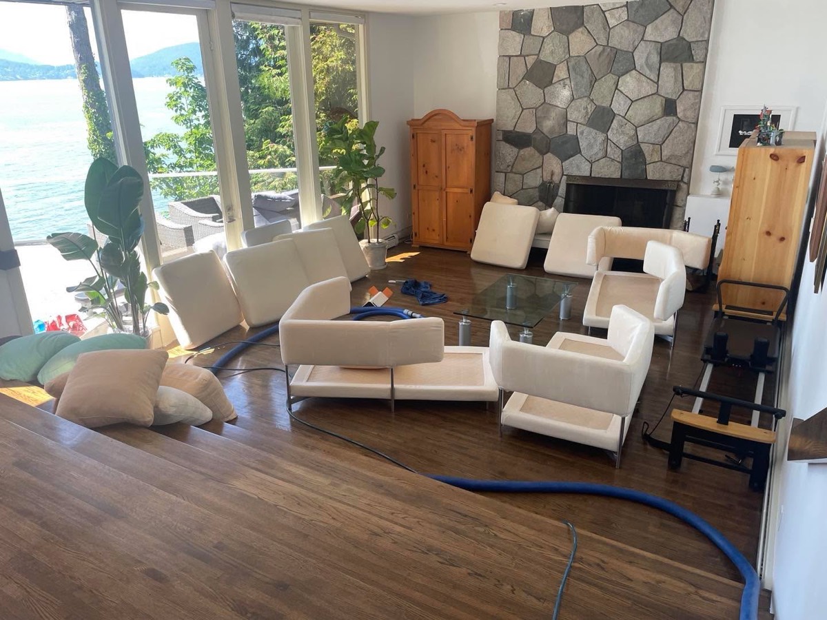 Modern armchairs and sofas cleaned in a Vancouver waterfront home with ocean and mountain views