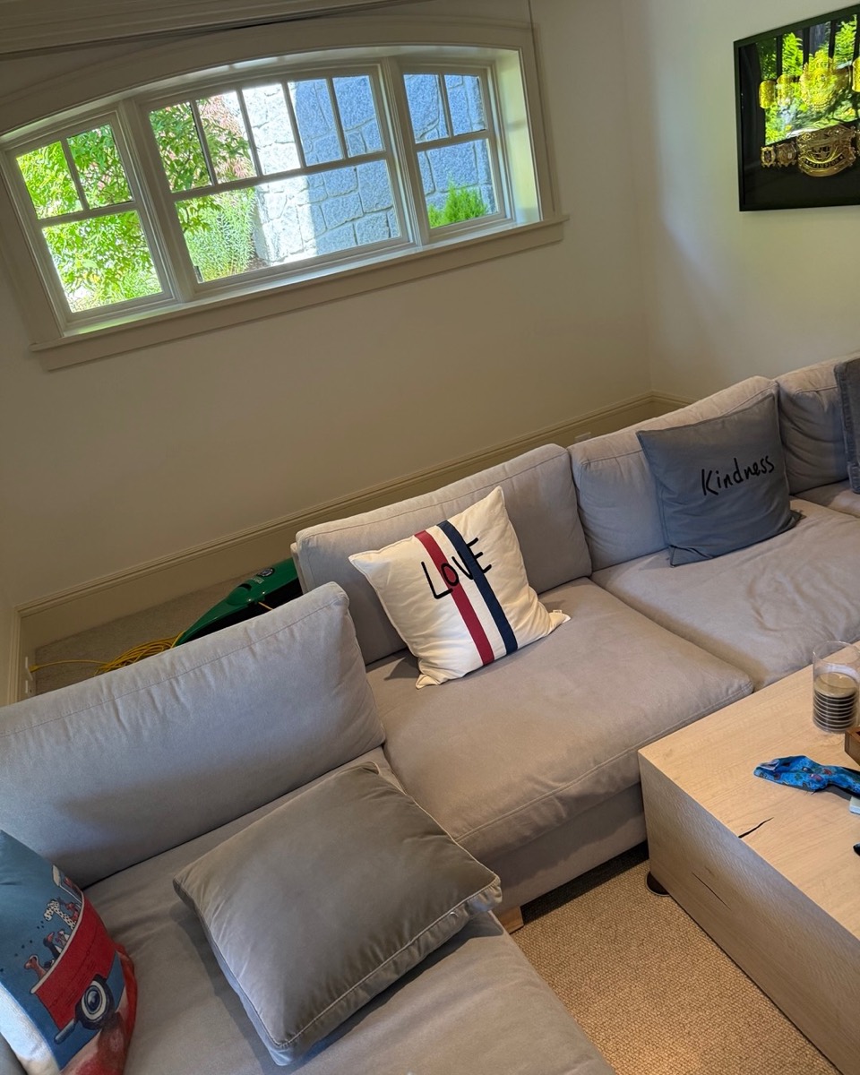 Clean grey sectional sofa after professional upholstery cleaning in a Vancouver media room
